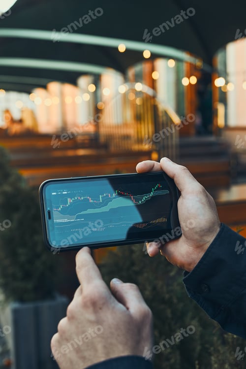 Preview: Person investing trading on stock cryptocurrency market using investing application on smartphone