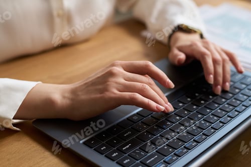 Preview: Hands Of Unrecognizable Woman Typing on Laptop at Work