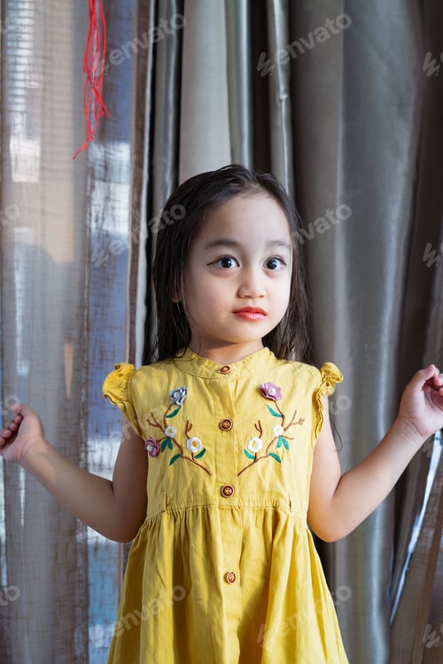Preview: Asian good looking little girl wearing makeup child is smiling, Happy little girl with beautiful dr