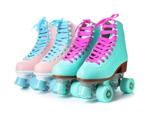 Preview: Pairs of bright stylish roller skates on white background
