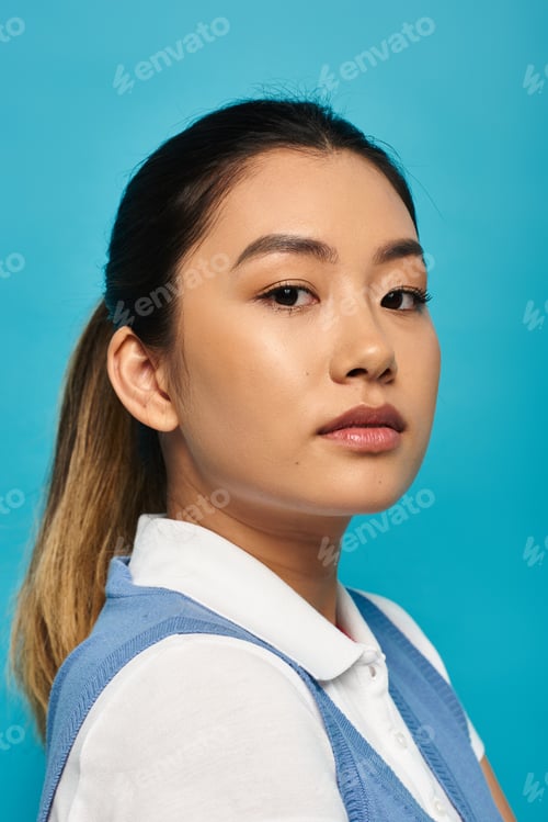 Preview: Asian woman in smart casual attire on blue background