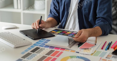 Preview: Graphic Designer Selecting Color Pairs on Computer for Creative Projects in Modern Workspace with