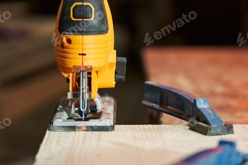 Preview: close-up of an electric jigsaw from the front with a laser pointer for precise cutting of a wooden