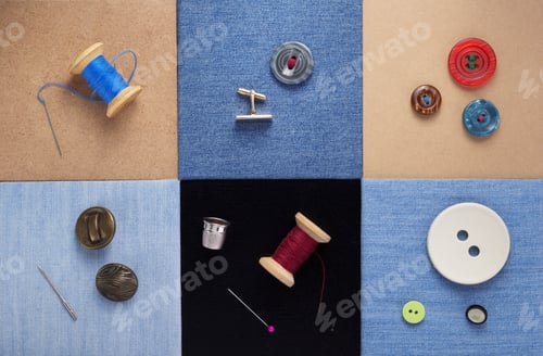 Preview: sewing tools and accessories on jeans background