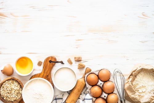 Preview: Baking ingredients at white wooden table
