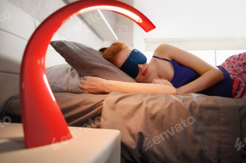 Preview: Woman In Bed Sleeping With Sleep Mask On Eyes