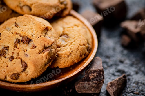 Preview: Delicious Chocolate Chip Cookies on a Wooden Plate