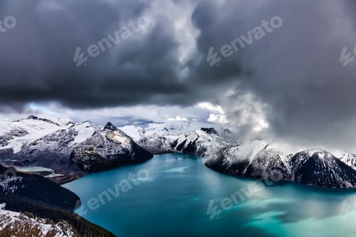 Preview: Landscape view of Garibaldi Lake vibrant cloudy fall season day