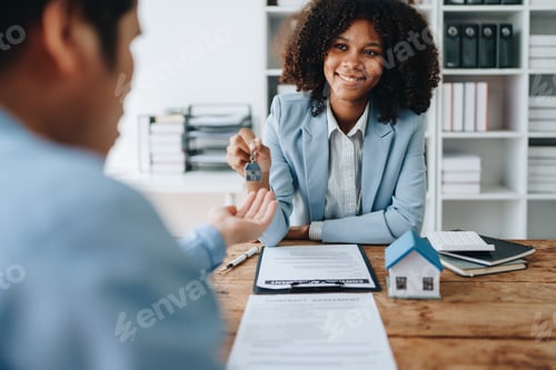 Preview: Female African american Real estate company to buy houses and land are delivering keys and houses