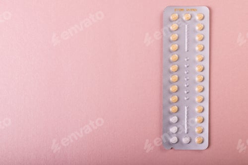 Preview: Directly above shot of medicine blister pack isolated over pink background, copy space