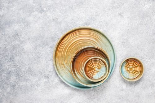 Preview: Different ceramic empty plates and bowls.