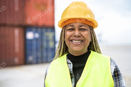 Preview: Happy African woman working in logistic terminal of container cargo