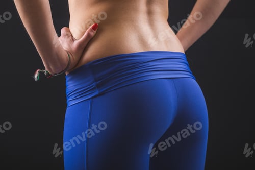 Preview: Sporty Female Bum and Back on Black Background