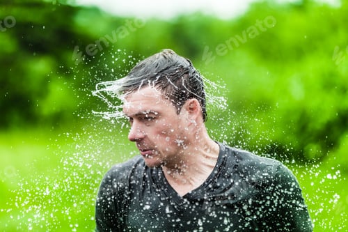 Preview: Young Adult Completely Drenched Shaking His head