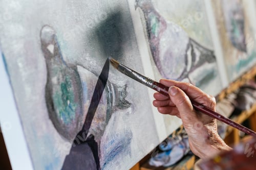 Preview: Anonymous senior woman painting on canvas in garden