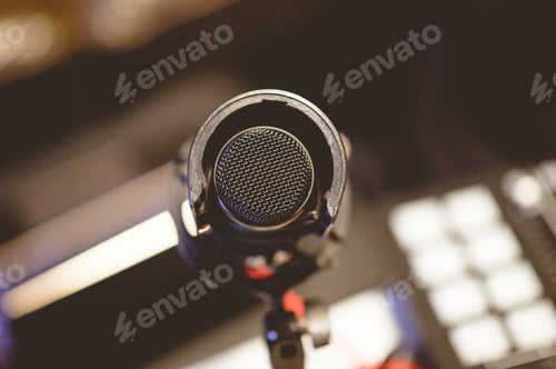 Preview: High angle view of a microphone in a studio under the lights with a blurry background