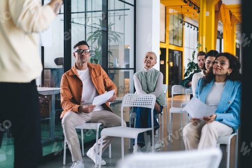 Preview: Businesspeople on briefing in spacious office