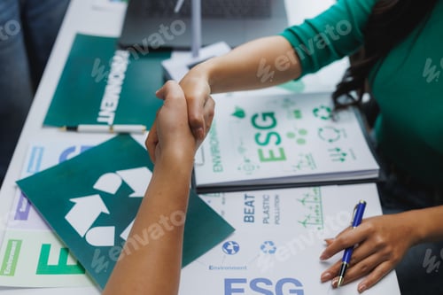 Preview: Managers shaking hands after reaching agreement on esg project