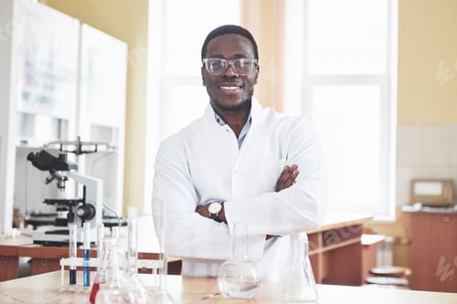 Preview: An African American worker works in a laboratory conducting experiments