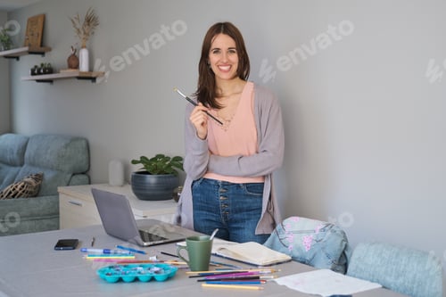 Preview: Portrait of an artist and entrepreneur woman smiling and looking at camera.