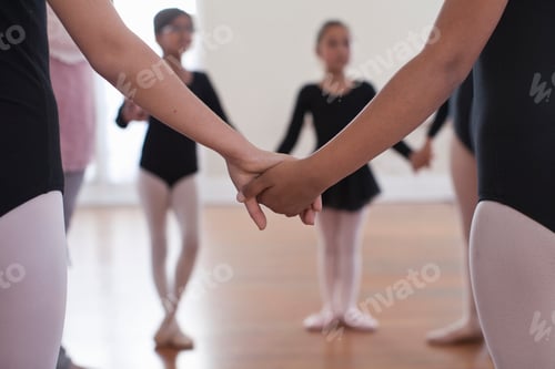 Preview: Young dancers holding hands in a circle at ballet class