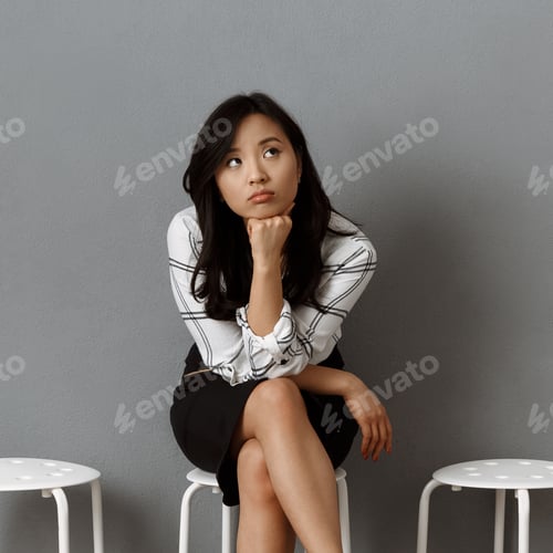 Preview: pensive asian businesswoman waiting for job interview