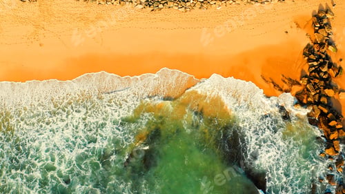 Preview: Beautiful ocean beach with yellow sand, aerial view.