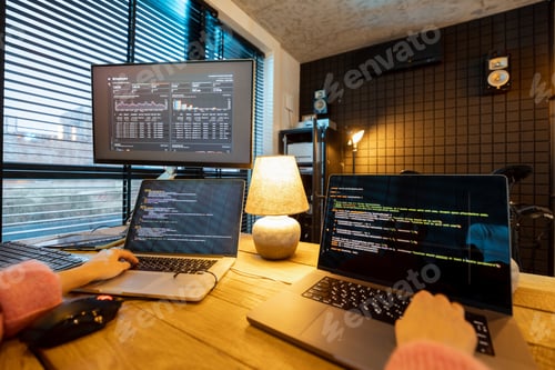 Preview: Female programmer writing programming code at cozy home workplace