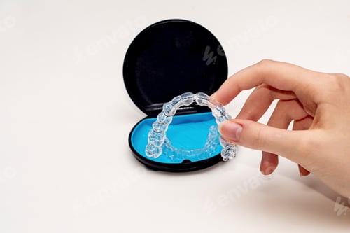 Preview: Teeth aligners in a storage case. Invisible braces. Clear teeth straighteners. Clear plastic braces