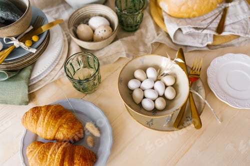 Preview: Dining table with Easter breakfast set. Eggs, pastries