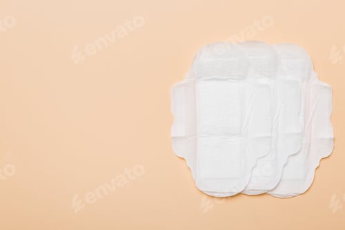 Preview: Women hygiene products or sanitary pad on colored background. Pastel color