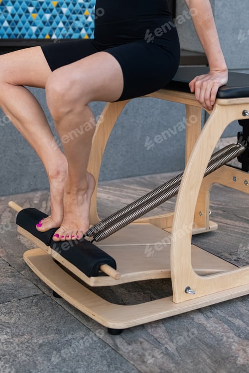 Preview: Pilates reformer chair woman fitness yoga gym exercise.