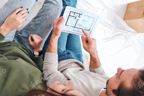 Preview: Young man pointing at tablet screen while having rest after removing