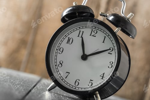 Preview: Alarm clock on an old wooden table