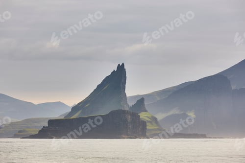 Preview: Faroe islands sunset dramatic coastline cliffs landscape in Vagar island.