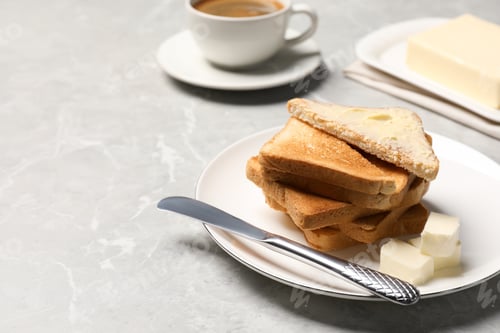 Preview: Tasty toasts with butter served on grey marble table. Space for text