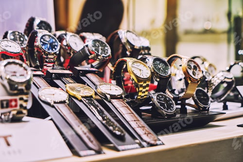 Preview: Showcase with various luxury analog wristwatches, soft focus