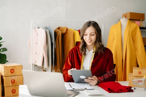 Preview: Fashion blogger concept, Young Asian women selling clothes on video streaming.Startup small business