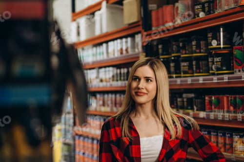 Preview: Young latin woman working in hardware store