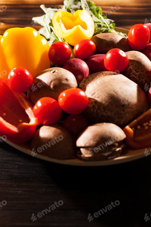 Preview: Different type of fresh organic vegetables on burned wooden back