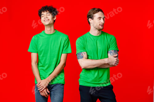 Preview: two men in green t-shirts are standing next to friendship