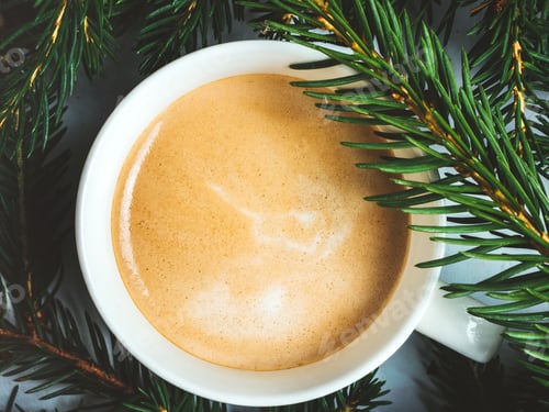 Preview: Warm Coffee Cup Surrounded by Evergreen Branches