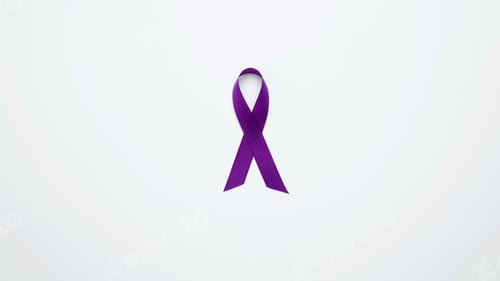 Preview: Purple ribbon held, symbol of support.Purple Epilepsy Awareness Day