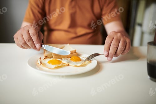 Preview: Senior Man Eating Fried Eggs