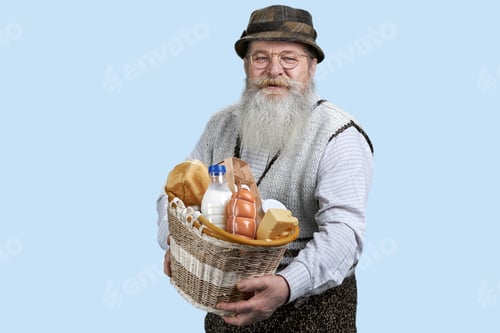 Preview: Portrait of senior man with food from grocery shop.