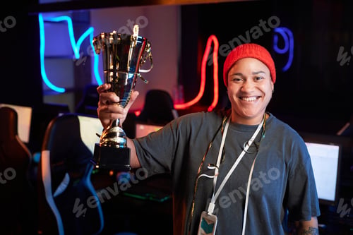 Preview: Smiling Black Woman Celebrating Victory in eSports Tournament