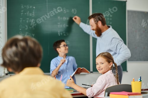 Preview: Harmony in learning: diverse children engaged at blackboard