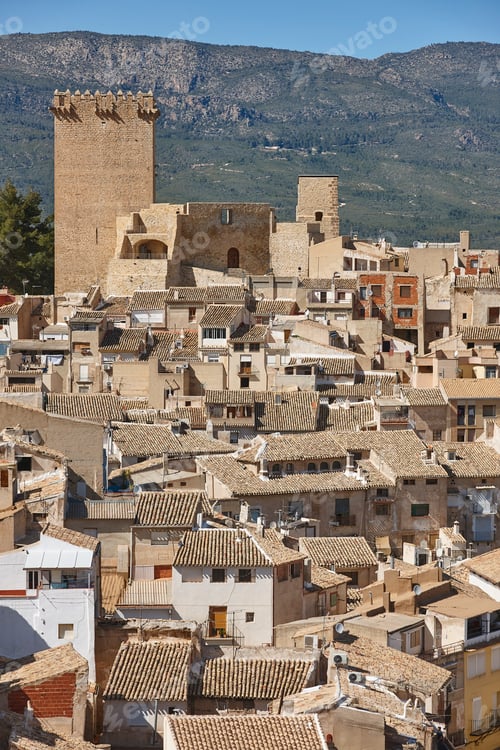 Preview: Picturesque ceramic tiled roofs and castle in Moratalla. Murcia, Spain