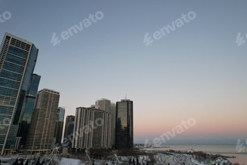 Preview: View of Chicago at night, showcasing the illuminated skyline of the city's towering skyscrapers