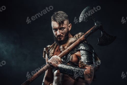 Preview: Medieval viking fighter holding huge axe on his shoulder